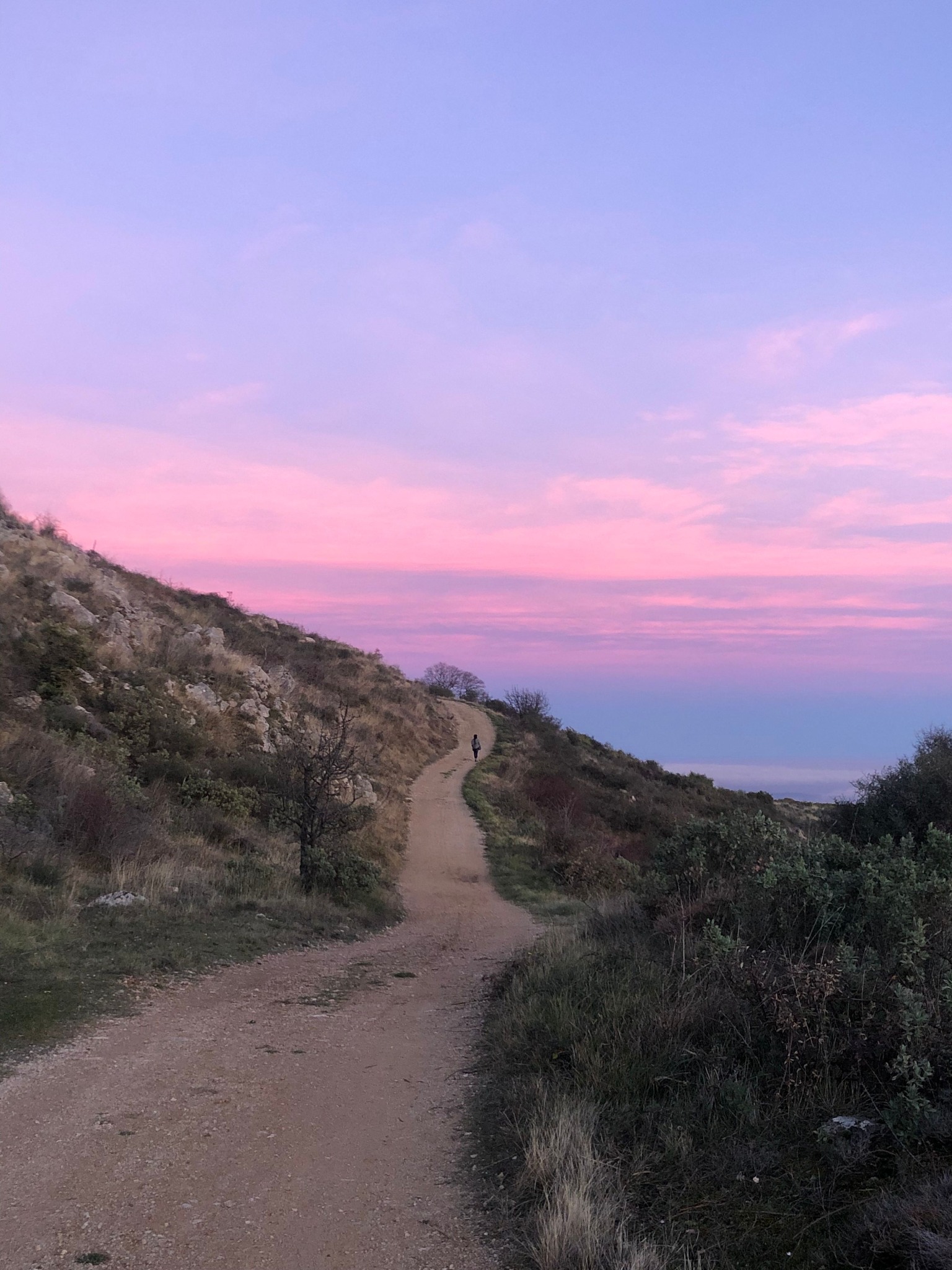 Western trail under an open sky